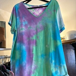 PTP on the tie-dye is 24 inches length is 28 inches. It’s teal green and purple